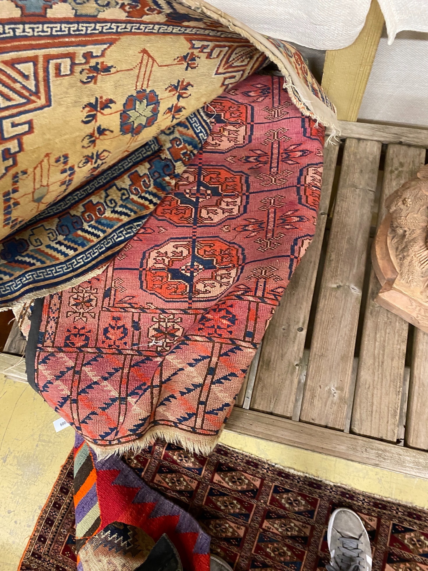 A Bokhara bagface rug, 122 x 69cm and four other rugs